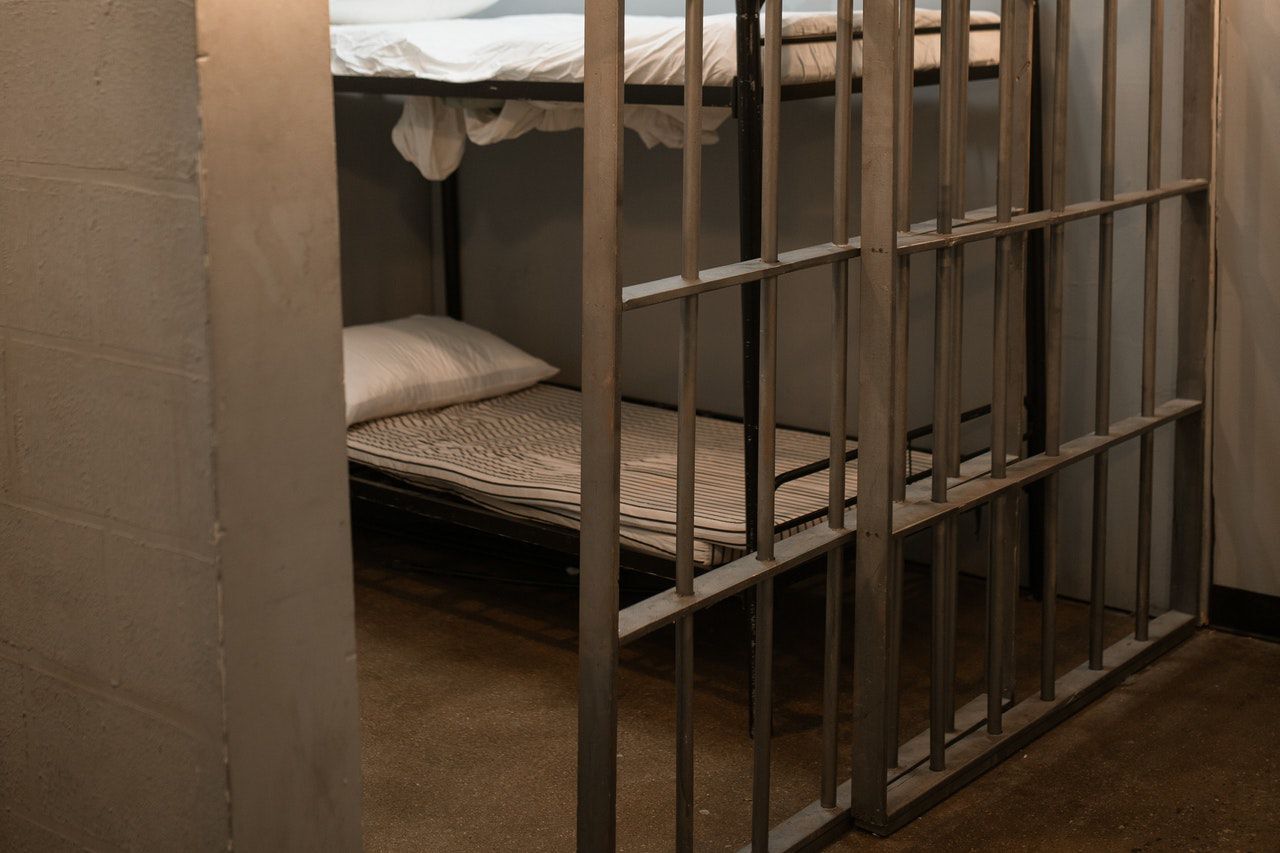 Why are inmates being vaccinated at the same time as the elderly and others?
